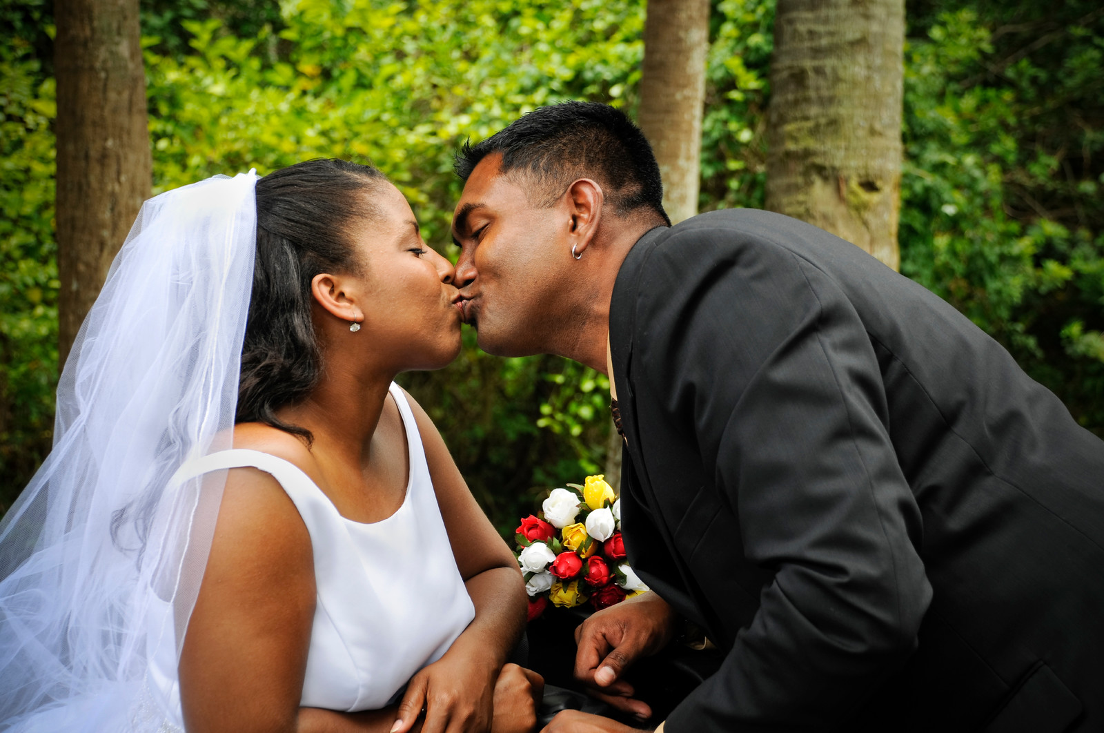 African American Bridal Couple sharing a Kiss